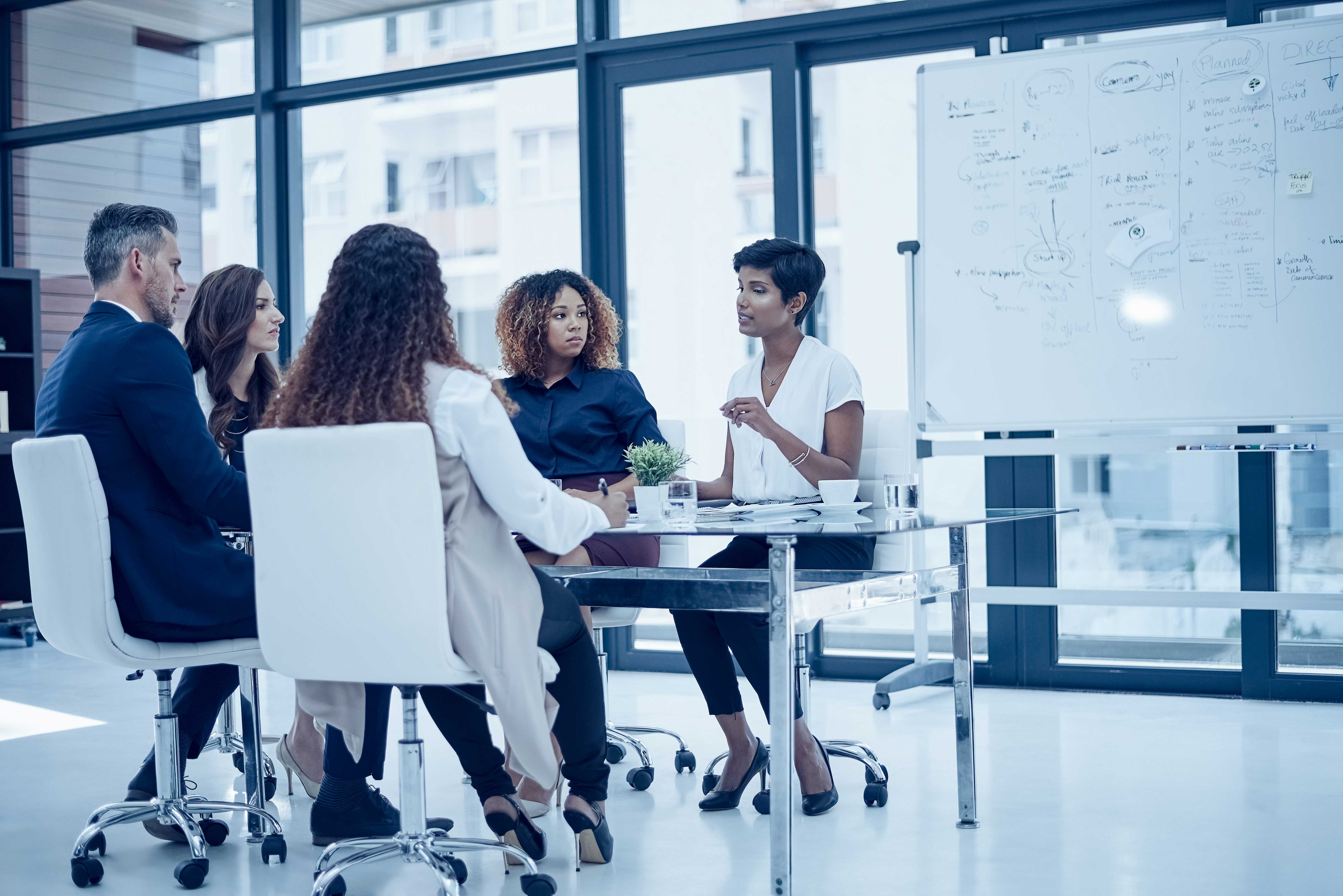 Accounts Payable Automation - Shot of a group of colleagues having a meeting in a modern office